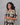 Women wearing a charcoal gray patterned kurti in a gray background