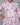 Woman wearing a floral dress with a gray background