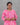 Woman wearing a pink and white patterned kurti against a gray background