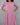 Woman wearing a pink dress with puffed sleeves against a gray background