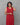 A women wearing tie and dye red color cotton kurti on a grey background