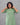 Model wearing women's plain green cotton 2pc kurti set